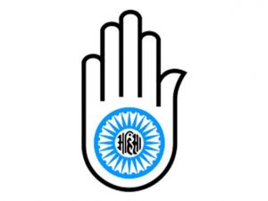 The hand with a wheel on the palm symbolises the Jain Vow of Ahimsa. The word in the middle is "Ahimsa". The wheel represents the dharmacakra which stands for the resolve to halt the cycle of reincarnation through relentless pursuit of truth and non-violence.